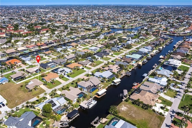 aerial view with a water view and a residential view