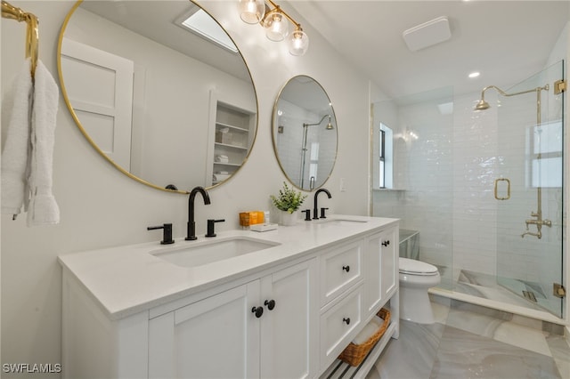 bathroom with toilet, double vanity, a walk in shower, and a sink