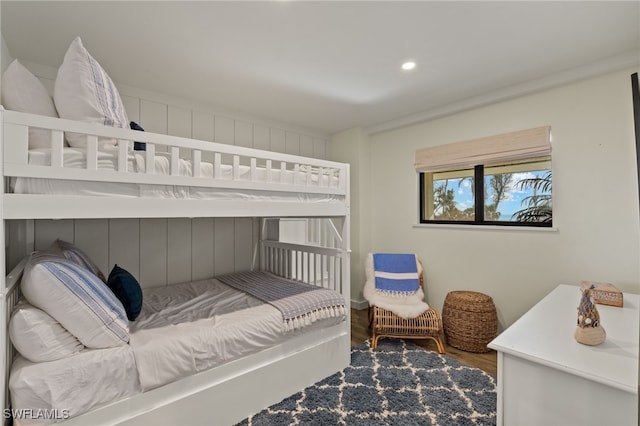 bedroom with recessed lighting and wood finished floors