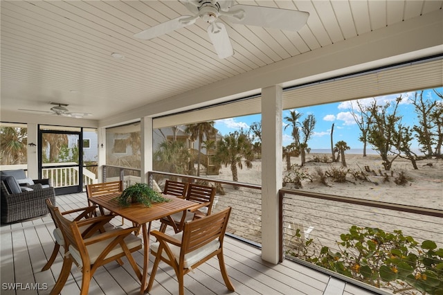 sunroom / solarium featuring ceiling fan