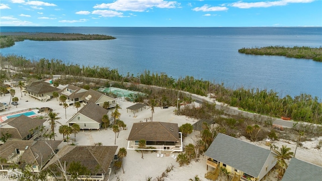 drone / aerial view featuring a residential view and a water view