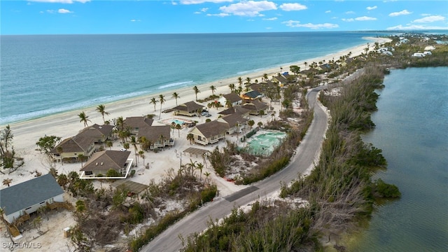 aerial view featuring a water view and a beach view