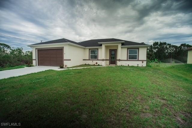 view of front facade featuring a garage, a front lawn, concrete driveway, and stucco siding