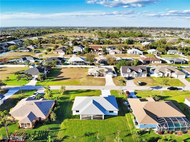 birds eye view of property with a residential view