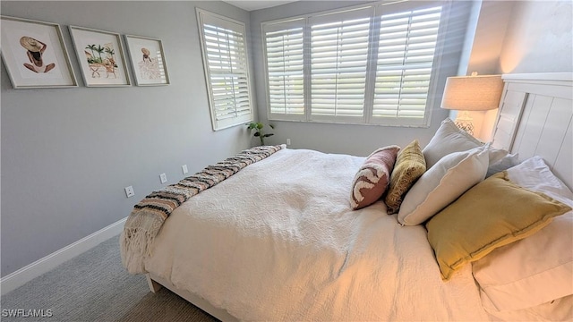 carpeted bedroom with baseboards