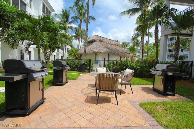 view of patio / terrace featuring a grill and fence