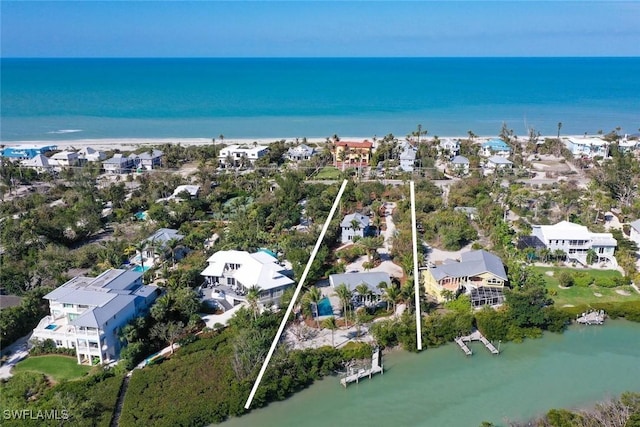 birds eye view of property featuring a water view and a residential view