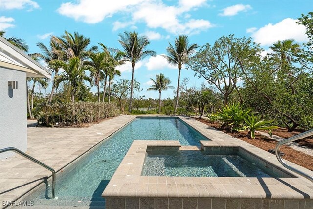 16891 Captiva Dr, Captiva, FL 33924 - view of swimming pool featuring a patio and a pool with connected hot tub