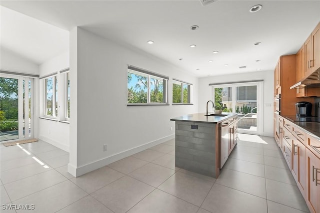 16891 Captiva Dr, Captiva, FL 33924 - kitchen with a center island with sink, a sink, recessed lighting, light tile patterned floors, and baseboards