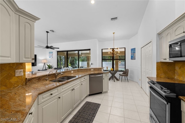 7735 Citrus Hill Ln, Naples, FL 34109 - kitchen with a sink, appliances with stainless steel finishes, healthy amount of natural light, and tasteful backsplash