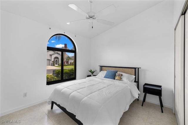 7735 Citrus Hill Ln, Naples, FL 34109 - bedroom with lofted ceiling, baseboards, and a ceiling fan