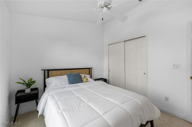 7735 Citrus Hill Ln, Naples, FL 34109 - bedroom featuring a closet, light tile patterned flooring, a ceiling fan, and baseboards