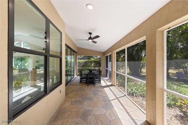 7735 Citrus Hill Ln, Naples, FL 34109 - sunroom with ceiling fan, lofted ceiling, plenty of natural light, and outdoor dining space