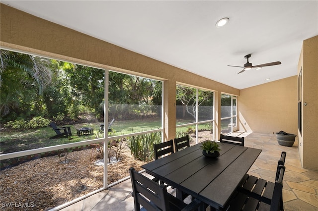 7735 Citrus Hill Ln, Naples, FL 34109 - sunroom featuring a ceiling fan, vaulted ceiling, and outdoor dining space