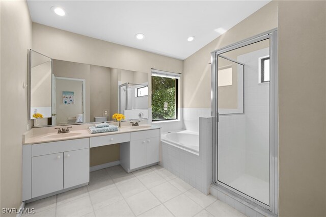 7735 Citrus Hill Ln, Naples, FL 34109 - full bathroom featuring a shower stall, double vanity, a bath, and tile patterned flooring