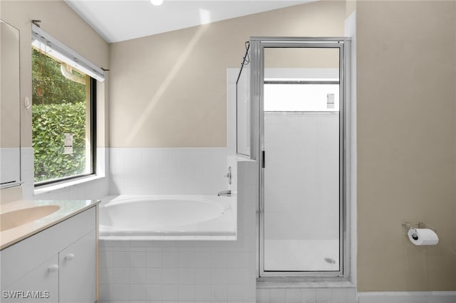 7735 Citrus Hill Ln, Naples, FL 34109 - bathroom featuring a stall shower, a garden tub, and vanity