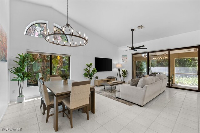 7735 Citrus Hill Ln, Naples, FL 34109 - dining room featuring a chandelier, high vaulted ceiling, ceiling fan, and light tile patterned floors