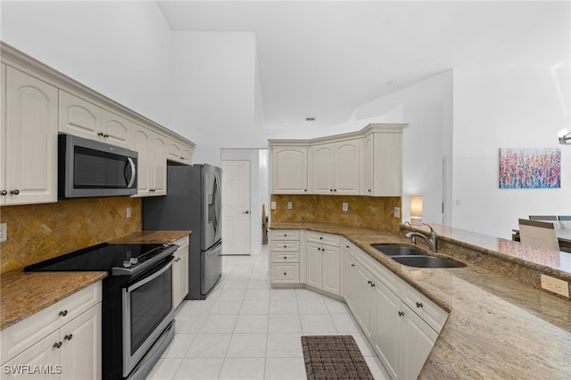 7735 Citrus Hill Ln, Naples, FL 34109 - kitchen with stainless steel appliances, a sink, light tile patterned floors, light stone counters, and backsplash
