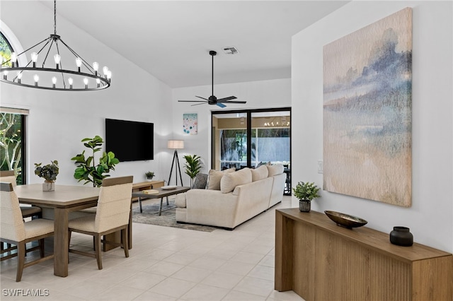 7735 Citrus Hill Ln, Naples, FL 34109 - living room with ceiling fan, a chandelier, plenty of natural light, and light tile patterned floors