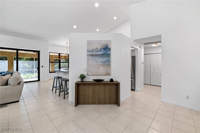 7735 Citrus Hill Ln, Naples, FL 34109 - living area featuring recessed lighting, light tile patterned flooring, and baseboards
