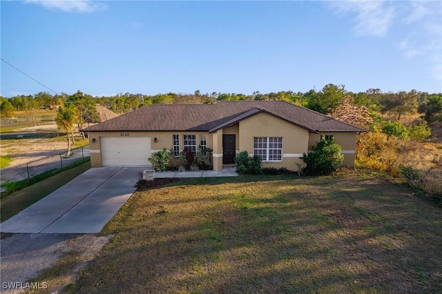 single story home with driveway, stucco siding, an attached garage, fence, and a front yard