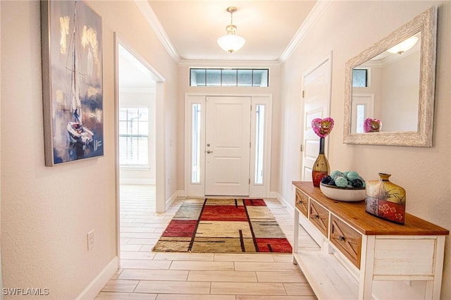 entrance foyer featuring wood tiled floor, visible vents, ornamental molding, and baseboards