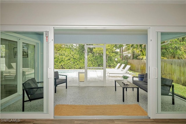 doorway featuring speckled floor