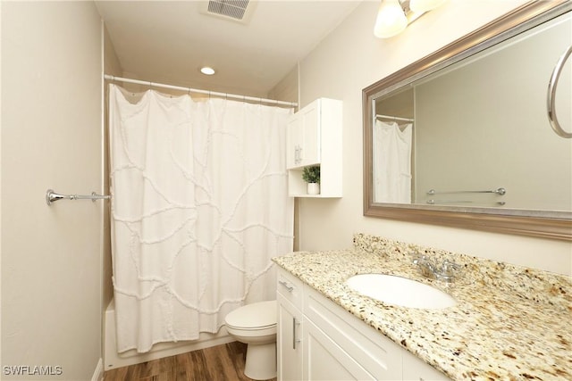 bathroom featuring recessed lighting, visible vents, toilet, vanity, and wood finished floors