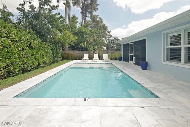 view of swimming pool featuring a fenced in pool, fence private yard, and a patio