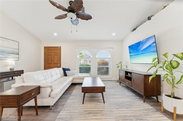 living room with ceiling fan, vaulted ceiling, wood finished floors, and recessed lighting