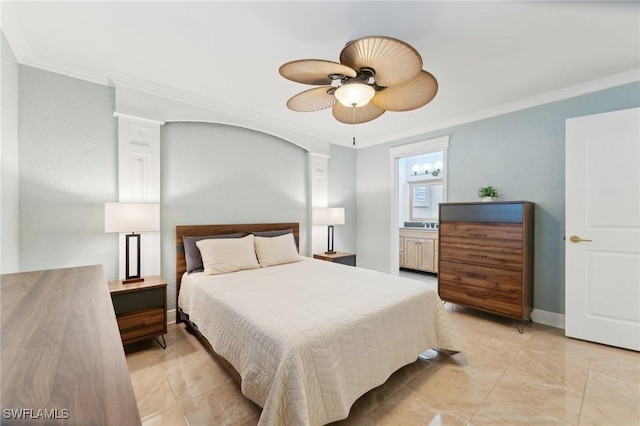 bedroom featuring ensuite bath, baseboards, ceiling fan, and crown molding