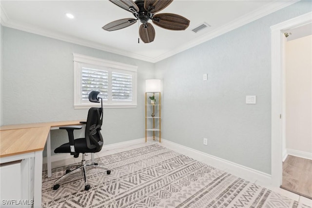 home office with ornamental molding, a ceiling fan, visible vents, and baseboards