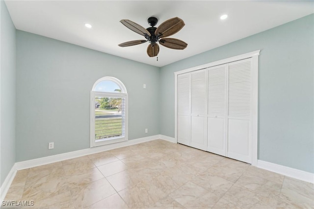 unfurnished bedroom featuring a closet, recessed lighting, a ceiling fan, and baseboards