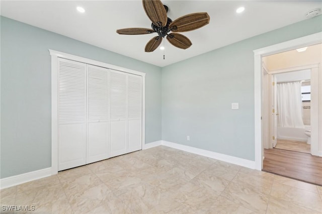 unfurnished bedroom featuring baseboards, a closet, and recessed lighting