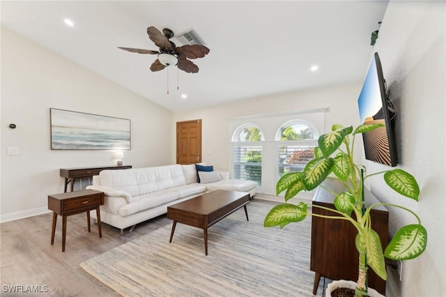 living area with lofted ceiling, ceiling fan, recessed lighting, wood finished floors, and baseboards