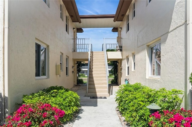 exterior space featuring a patio area and stucco siding