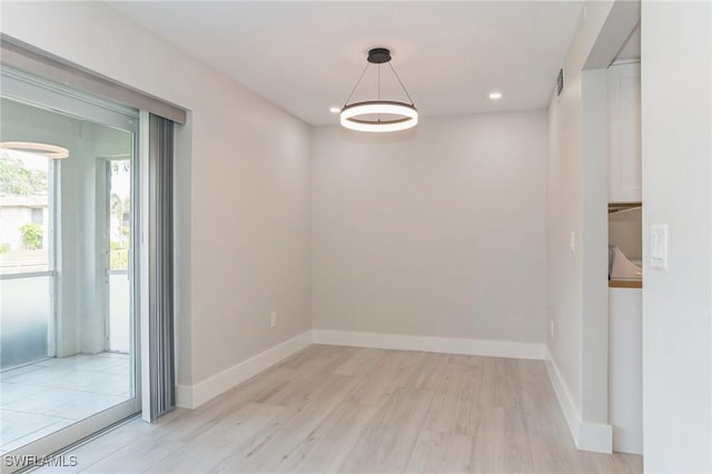 unfurnished room with recessed lighting, baseboards, and wood finished floors