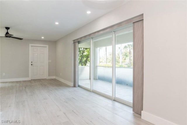 empty room with light wood-style floors, baseboards, a ceiling fan, and recessed lighting