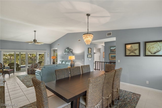 dining area featuring light tile patterned floors, visible vents, vaulted ceiling, baseboards, and ceiling fan with notable chandelier