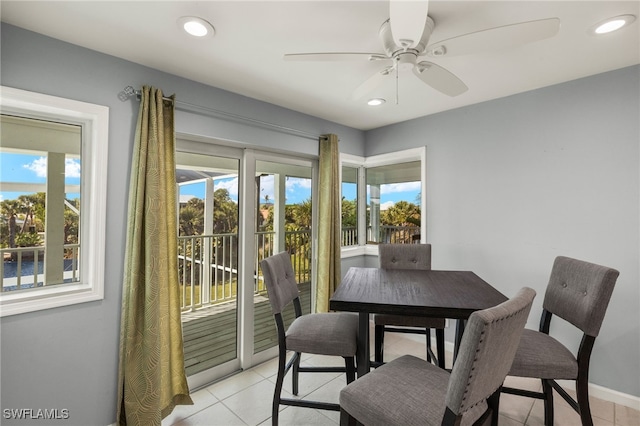 dining space with light tile patterned flooring, a wealth of natural light, and recessed lighting