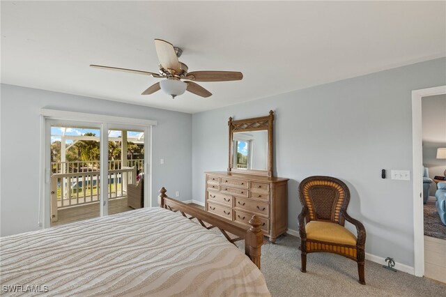 bedroom with access to exterior, light colored carpet, baseboards, and a ceiling fan