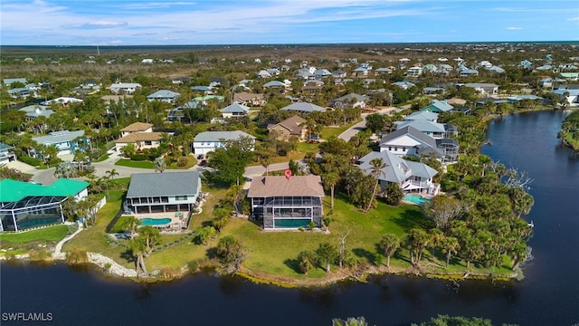 bird's eye view with a water view and a residential view