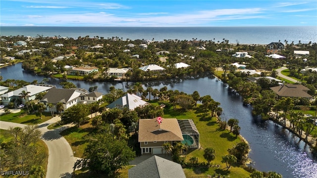 aerial view with a water view and a residential view