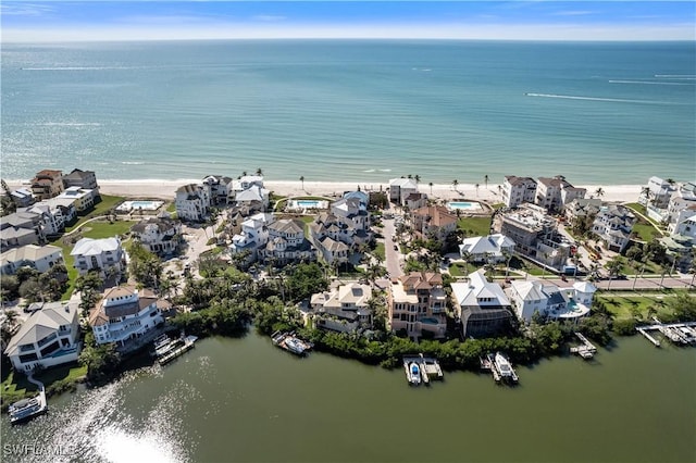 bird's eye view featuring a water view and a residential view