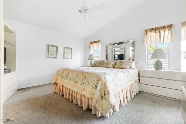 bedroom with lofted ceiling, light carpet, and ceiling fan