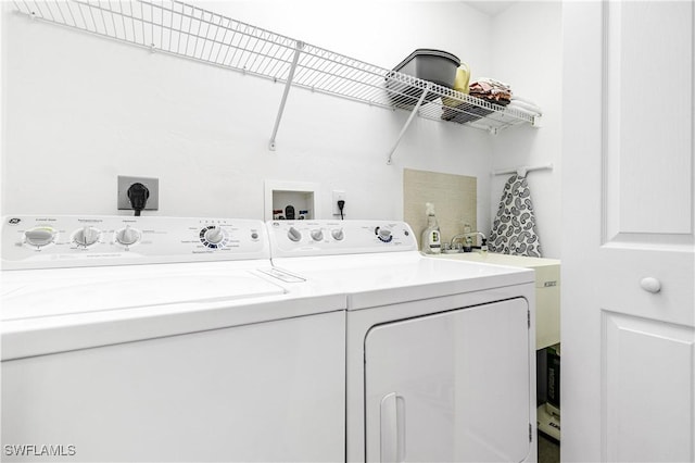 laundry room featuring laundry area and washing machine and clothes dryer