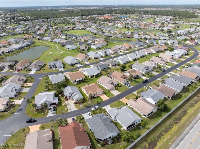 aerial view featuring a residential view and a water view