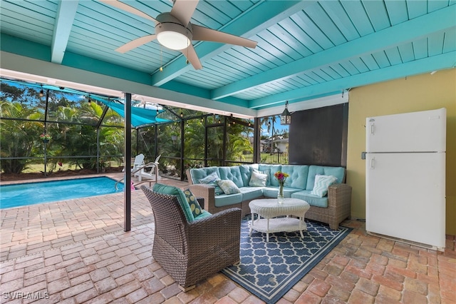 view of patio featuring outdoor lounge area, a lanai, a ceiling fan, and an outdoor pool