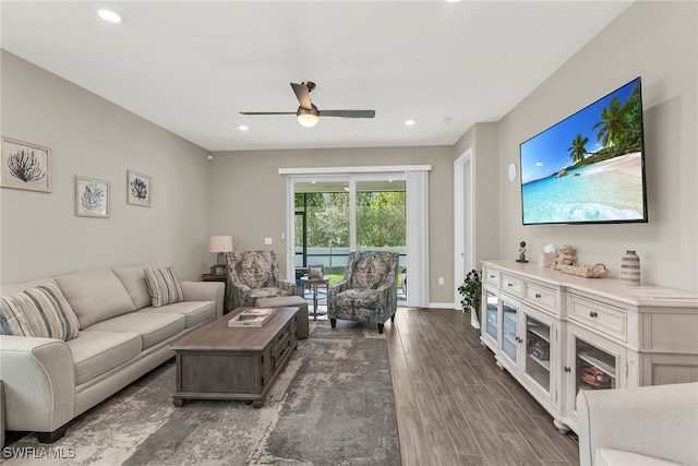 living room with baseboards, ceiling fan, wood finished floors, and recessed lighting