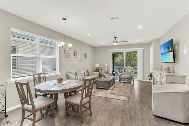 dining area featuring recessed lighting, visible vents, baseboards, and wood finished floors